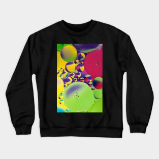 Colorful close up of oil drops in water Crewneck Sweatshirt